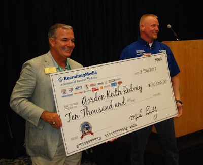 CEO of Randall-Reilly Business Media and Information Mike Reilly, left, presents 2012 Trucking’s Top Rookie and Gordon Keith Redvay with a check for $10,000 at The Great American Trucking Show in Dallas, Texas, on Aug. 24.