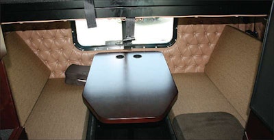 There’s a dinette option for the sleeper. This arrangement includes an upper bunk and the convenience of the large table and facing seating.