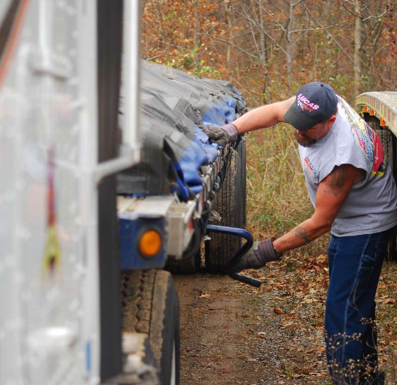 Dan Heister adjust flatbed landing gear