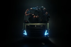 Volvo FH cabover packed full of people