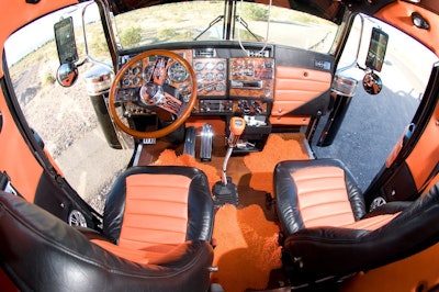 Chivington says the black and orange leather interior of the Old Rigger was upholstered by a company in Iowa that makes seats for airplanes. The truck’s cab also sports blanked-out sleeper windows, wood flooring and a 21-inch flat-screen TV.
