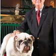 Mack’s current North American chief, Kevin Flaherty, poses with Mack the Bulldog.