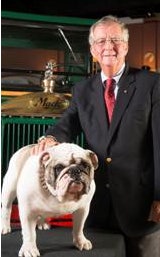 Mack’s current North American chief, Kevin Flaherty, poses with Mack the Bulldog.