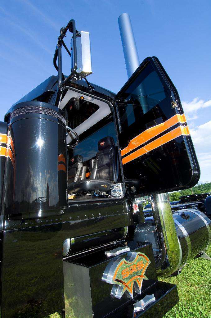 To outfit Triple One with suicide doors Beaudoin and co. had to move the daycab&rsquo;s air cleaners forward a little. &ldquo;Then we took the passenger and driver side doors and we cut the tops off the doors,&rdquo; moving the passenger main panel to the driver side and vice versa. Poppers for door latches give the exterior a smooth, handle-less finish.