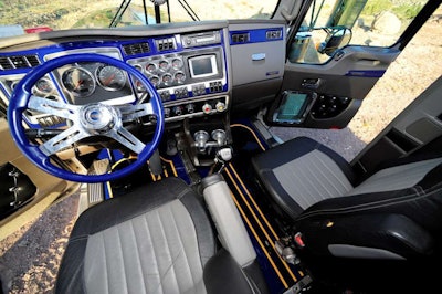 The floor of the cab reflects the exterior’s paint job, and the steering wheel and dash also match.