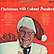 This is one of at least three Christmas music compilation albums marketed under the Colonel Sanders name. Read more on a Facebook page devoted to the topic. Search for “Christmas with Colonel Sanders.”