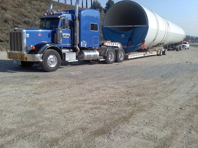 This middle section of a 300-foot-tall windmill tower was sent in by reader Paul Goldstein. It was hauled from San Diego, Calif., to Jawbone Canyon by the 2009 Peterbilt 367, powered by a 600-hp Cummins with an 18-speed transmission and two-speed rears. Load weight: 106,000 lbs.
