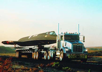 1986: T800 line is launched for on-off highway application. Seen here transporting a retired SR-71 in 1991 from Mojave Desert to Seattle.