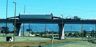 A receiver snapped this pic waiting on the driver to get to his location “so we can unload him.” Authorities, however, due to the width and weight of the loaded pipe, had to “shut down the bridge so he could get to us.”