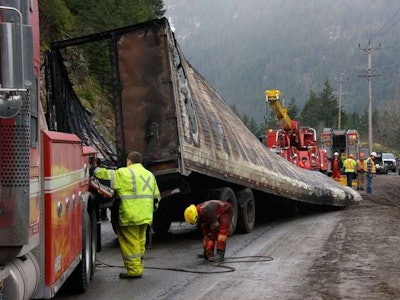 Jason Davis and his crew work the scene of an accident during the filming of the first season of “Highway Thru Hell.”