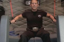 “Trucker Trainer” Bob Perry, president of Rolling Strong (Freightliner’s partner in building the FIT system), works out with the FIT system in the sleeper of a Cascadia.