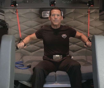 “Trucker Trainer” Bob Perry, president of Rolling Strong (Freightliner’s partner in building the FIT system), works out with the FIT system in the sleeper of a Cascadia.