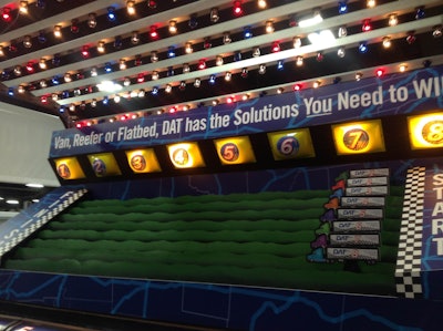 Winners roll balls into a series of holes to advance their truck for a t-shirt or hat at DAT’s MATS booth #65188 in the West Wing.