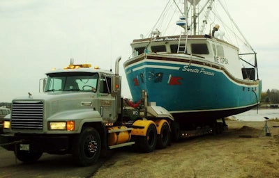 Tim Toppin of Toppin’s Diesel and Marine Service (Maine) sent in this shot, which he describes as showing an annual removal of the “48-ft.-long by 23-ft.-wide dragger”, the Surrette Pricess, for maintenance. “This one always makes me sweat a little bit. It weighs more than 100,000 pounds alone. Getting it placed on the trailer in the correct position and then pulling it out of the water like you would do with your bass boat gets a little tense.”