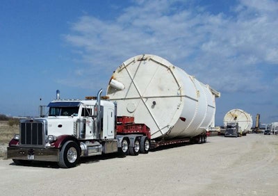 “105-foot long by 20-foot wide by 22-foot, 3 inches high,” Darrell Hendrix of STS Heavy Hauling said of these silos. “The customer was told they could not be moved in one piece… But we moved 12 of them in one piece.”
