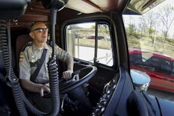 In this photo from the Chattanooga Times Free Press, Tennessee State Trooper pilots the truck used by highway patrolmen to look for motorists breaking driving laws.