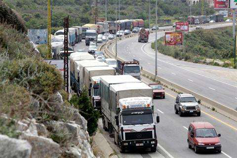 Syrian trucks backed up on bridge in Jordan