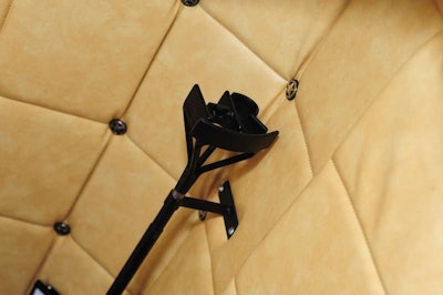 Hooten uses branding irons as curtain rods and cowhide as curtains for the sleeper and the sleeper’s window he had installed. Belt buckles and leather straps serve as curtain ties.