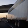 Rolling truck on highway at dusk