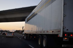 Rolling truck on highway at dusk