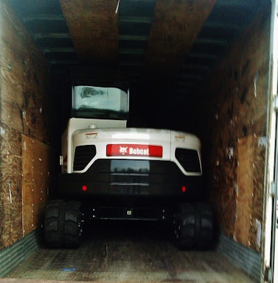 John Burnett ultimate fit “two rubber-backed trackhoes” snugly in this van trailer.
