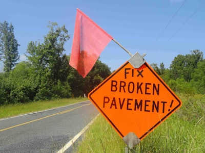 A road sign in Anson Co., N.C., in which someone hopes to send a message to lawmakers hoping for a little road support.