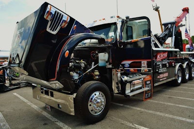 This 2013 Freightliner 122SD heavy-haul wrecker of Kling Towing and Recovery, pictured when shown hood up for an attendee view on the 505-hp Detroit at the 75 Chrome Shop earlier this year, was featured in the July 2013 Severe Duty Report from Freightliner Trucks. You can sign up for the monthly email newsletter via this link. | Photo by Aaron Heine