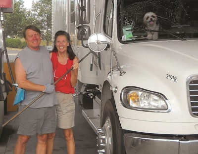 Gary and Barb Shade with pup Oliver and the couple’s Freightliner M2 expediter
