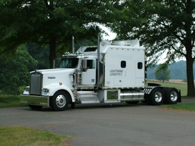 The sister truck to this beautiful Lightning Logistics-owned 2001 Kenworth W900 with a 2001 500-hp Caterpillar C15 engine – “sort of our flagship truck,” says co-owner Joe Hammerslough – is spec’d similarly and owned by an owner-operator leased to the company who has family ties in the Bay Area and is paying off a new transmission. “He’s not looking forward to getting rid of his truck” just to run in California.