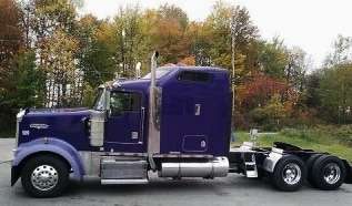 Small fleet owner-operator Chip Shirey’s 1998 Kenworth W900, hauling a variety of open-deck freight.