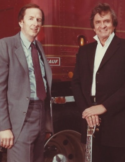 Former Fruehauf executive Michael Davis and Johnny Cash in a promotional photo.