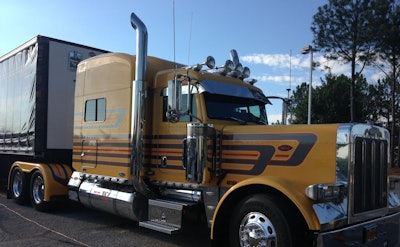 The 2007 Peterbilt 379 used by Lawler and her crew to transport their concert equipment. The truck and trailer double as a stage for Lawler and her band at their nationwide tour stops.
