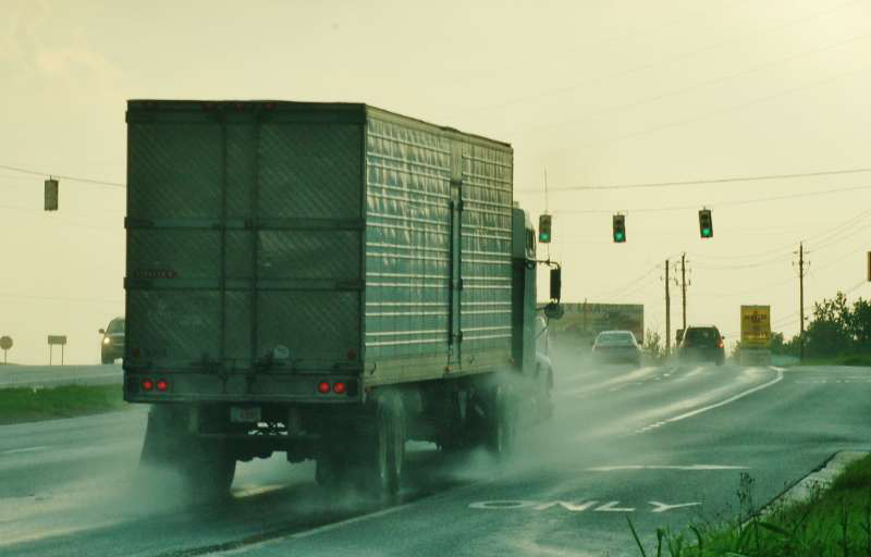Truck in rain on highway