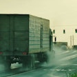 Truck in rain on highway