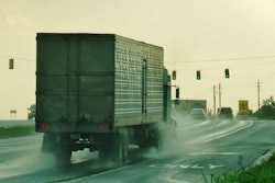 Truck in rain on highway