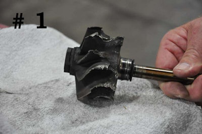 This turbine wheel was hit by engine pieces that came through the exhaust manifold.