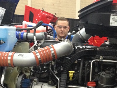 Brian Smith, from Rush Truck Center – Austin, troubleshoots a Paccar MX engine.