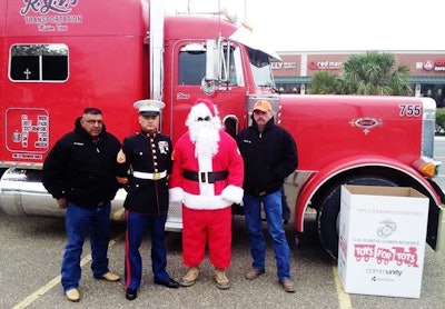 Rodriguez (left) with Sgt. Santa and crew.