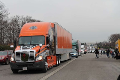 This Schneider National truck was among those in a convoy bearing tens of thousands of wreaths as they arrived at Arlington National Cemetery.