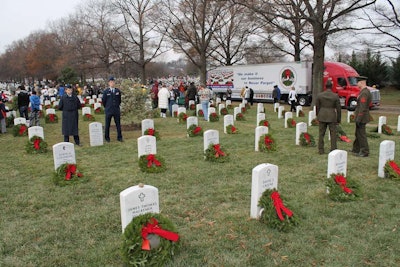 A section of Arlington National Cemetery is adorned with remembrance wreaths that were delivered by Hartt Transportation Systems, Inc.