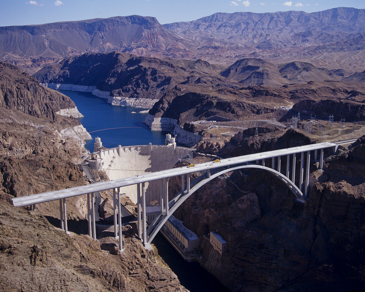 BIG HAUL | Apex transported more than 8,000 tons in 320 truckloads’ worth of special grind cement from Mitsubishi Cement at Lucerne Valley, Calif., to a batch plant at the bridge construction site over a three-year period in support of the Hoover Dam Bypass Bridge project. The bridge is the longest arched concrete bridge in the western hemisphere. It is the second-highest bridge in the United States and 14th in the world. The bridge contains the world’s tallest concrete columns. The bridge alone cost $114 million to construct. The dam behind it only cost $36 million to construct. Visit the project site for additional information.