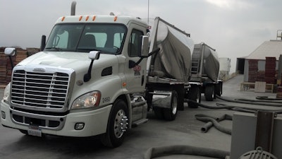 Apex trucks are outfitted with “permanent video cameras” — “In the beginning,” says company rep Denny Wyatt, “drivers reacted negatively.” But since, he adds. with clear examples of the help the cameras can be to both driver and fleet in the event of a not-at-fault crash, driver views on the cameras have improved. More than 70 percent of drivers in the fleet have converted to electronic logs, with Qualcomm software and hardware. The company takes advantage of the long combination vehicle (LCV) laws in Arizona, Nevada, Utah and Idaho to transport up to 129,000 gross weight and 45 tons of payload in units that are up to 105-feet in length. In addition, given the difficulty of return loads in specialized bulk hauling, Apex has developed a fleet of pneumatic trailers that offer separate dedicated compartments in the same trailer, Wyatt says.