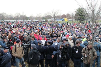 Volunteers gather for the opening ceremony at Arlington National Cemetery. The American Trucking Associations’ Share the Road Truck can be seen in the background. This was one of several trucks who participated in a special convoy from Maine to Arlington, stopping at schools, monuments, veterans’ homes and communities along the way.