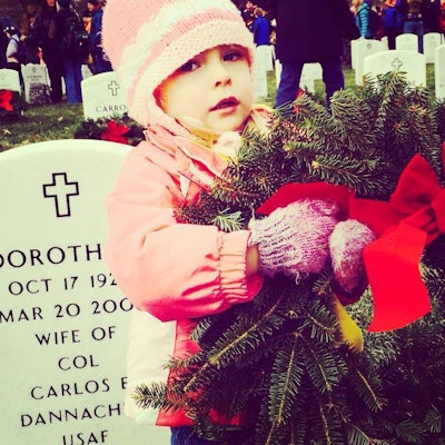 Volunteers ranged from uniformed service members and gray-haired veterans to the young girl pictured here.