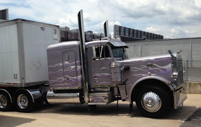 Unload at the Home Depot — an otherwise garden-variety load of consumer products at the Home Depot dresses up a little bit behind this purple-flamed Pete — shot sent in by Jimmy Richards.