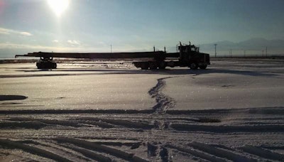A beatiful landscape here from David Forfar, this 2005 Peterbilt “hauling a load of 120-foot utility poles from Oregon to Arizona.” The shot was taken in December of 2013 along the way in Nevada