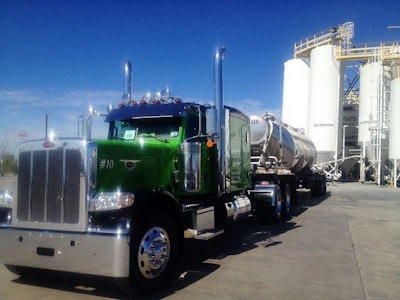 This 2014 Peterbilt 389 was custom-ordered from the Peterbilt plant in Denton, Texas, built for Cris and Kelly Bocanegra of Martindale, Texas. It was put into service just this past October, and is here pictured unloading in Von Ormy, Texas