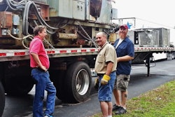 Left to right: Steve Bailey sees to it that Gerald Paquette and George Parker secure things properly.