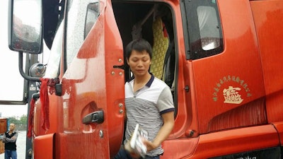 This Chinese owner-operator (dubbed owner-drivers there) showed us around his rig. Like in Europe, they’re all cabovers in China, and the sleeper “berths” are more like a cot squeezed in behind the seats.