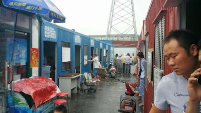 At this truck stop, shipping containers had been turned into offices for freight brokerages. The brokers working the offices have lined up loads, and the owner-operators at the truck stop can get loads from them. Nearly all of these containers here housed broker offices.
